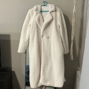 Maxi length white fur coat with rhinestone buttons